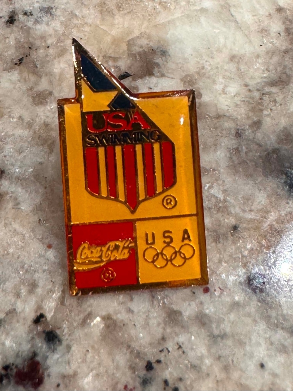 vintage Olympic commemorative pin featuring USA Swimming, sponsored by Coca-Cola